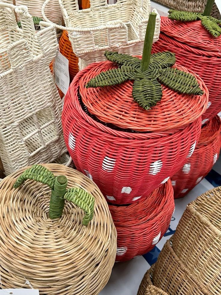 Woven baskets shaped like large red berries, ideal for farmhouse strawberry decor.