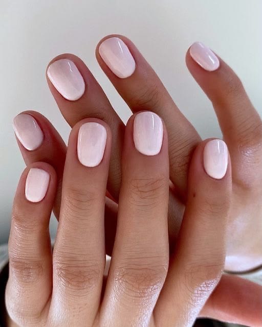 Short milky pink nails with a soft sheer finish, short light pink nails, short soft pink nails, short round nails, milky nails, sheer pink manicure, neutral pink nails, clean girl nails, natural looking nails, gel nails