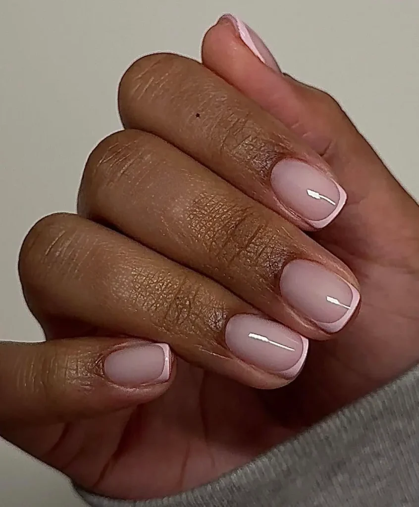 Short light pink nails with soft pink micro French tips, short soft pink nails with a thin French tip, short milky pink nails with a sheer base, minimalist pink French manicure, short square nails, pink French tip nails, pastel pink nails, clean girl nails, subtle nail design, gel manicure